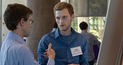 Liam Palmer explaining a CBES poster
